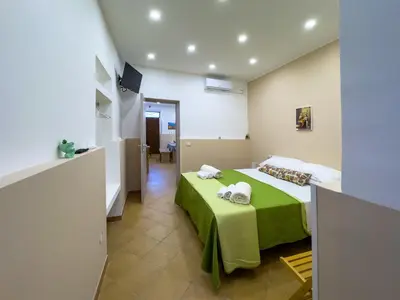 Letto o letti in una camera di Le Tre Ninfe - Centro storico Riposto