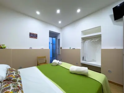 Letto o letti in una camera di Le Tre Ninfe - Centro storico Riposto