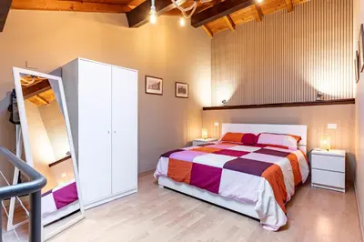 Letto o letti in una camera di GuestHost - Le Ciminiere Home - Central apt near the station