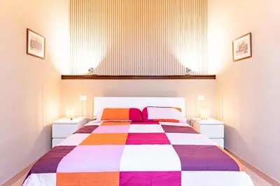 Letto o letti in una camera di GuestHost - Le Ciminiere Home - Central apt near the station
