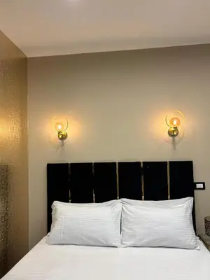 Letto o letti in una camera di Le Suites del Corso Catania Centro