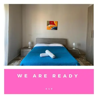 Letto o letti in una camera di Don Pedro Rooms Riposto