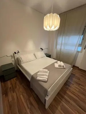 Letto o letti in una camera di Casa Fiera Catania
