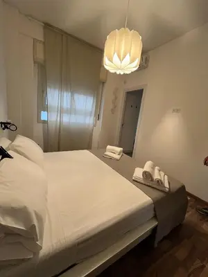 Letto o letti in una camera di Casa Fiera Catania