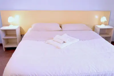 Letto o letti in una camera di Evelyn guest house