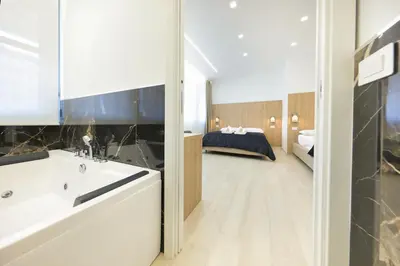 Letto o letti in una camera di Suite del Corso Sicilia