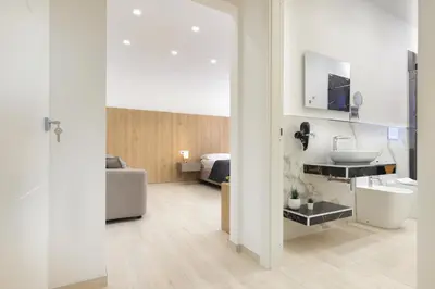 Letto o letti in una camera di Suite del Corso Sicilia