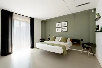 Letto o letti in una camera di Villa Monterosso, Acicastello