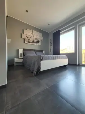 Letto o letti in una camera di Luca's Garden B&B in Catania