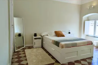 Letto o letti in una camera di Casa Marlene