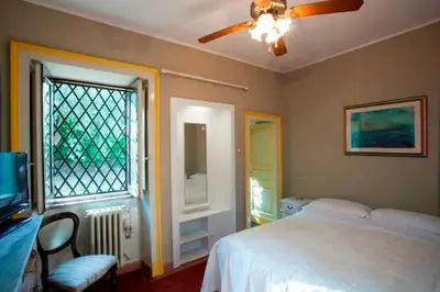 Letto o letti in una camera di VILLA VISCALORI A garden with pool and see view near Etna