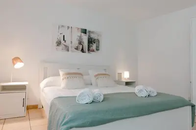 Letto o letti in una camera di Loft Moderno Centro , Villa Bellini , Bedda Matri