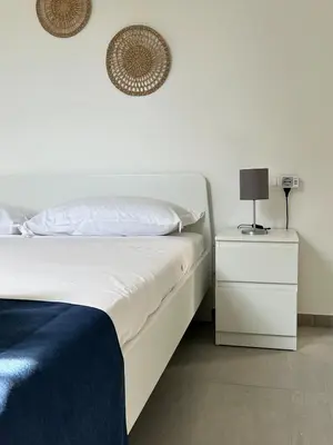 Letto o letti in una camera di Sunshine Apartment Acireale