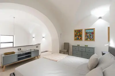 Letto o letti in una camera di Arte della gioia apartment