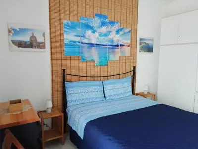 Letto o letti in una camera di Casa Le Ancore