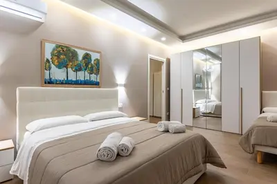Letto o letti in una camera di GuestHost - Lovely Apartments in Borgo Sanzio - M Giuffrida&Italia