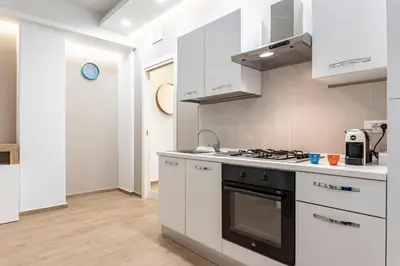 Cucina o angolo cottura di GuestHost - Lovely Apartments in Borgo Sanzio - M Giuffrida&Italia