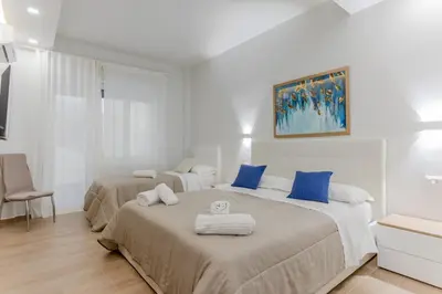 Letto o letti in una camera di GuestHost - Lovely Apartments in Borgo Sanzio - M Giuffrida&Italia