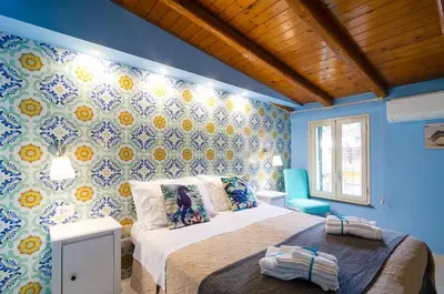 Letto o letti in una camera di Casa delle Zammare Fronte mare centro storico