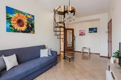 Area soggiorno di Spacious Apartment with Sea View in Aci Castello