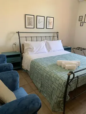 Letto o letti in una camera di Casa Luce Santa Tecla Apartment