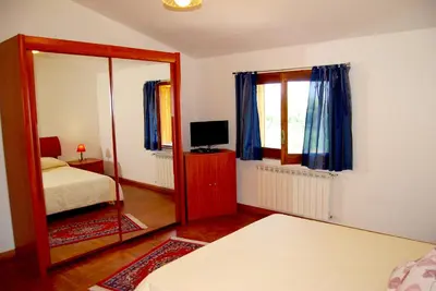 Letto o letti in una camera di Casa La Vigna