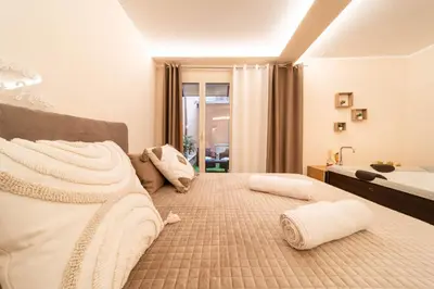 Letto o letti in una camera di Desiree Luxury House- vasca idromassaggio