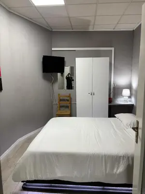 Letto o letti in una camera di Casa Rita Standard Room