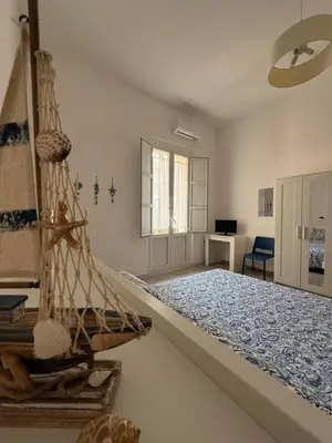 Letto o letti in una camera di Casa Nerina