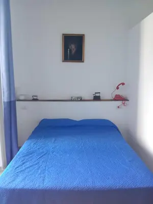 Letto o letti in una camera di CasaStazionePicanello