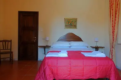 Letto o letti in una camera di Villa Solaria
