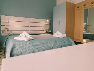 Letto o letti in una camera di B&B Villa Martoglio