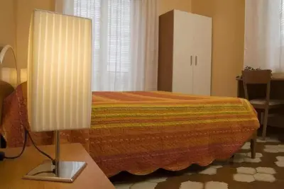 Letto o letti in una camera di B&B Villa Martoglio
