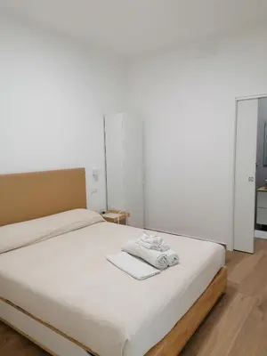 Letto o letti in una camera di Dell'Ova 98 Rooms