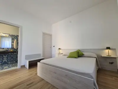 Letto o letti in una camera di B&B testa di Moro