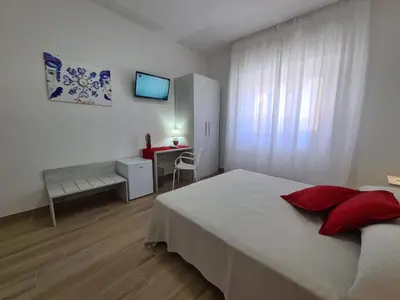 Letto o letti in una camera di B&B testa di Moro
