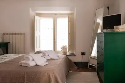 Letto o letti in una camera di Alessandro Manzoni Apartments - Exclusive brand 