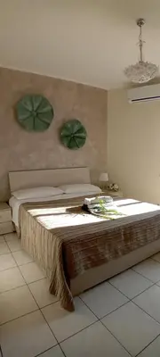 Letto o letti in una camera di Sicilia in cartolina