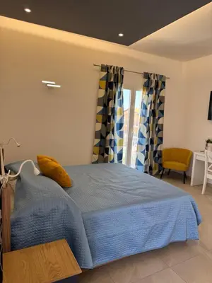 Letto o letti in una camera di Casa MaLù