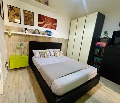 Letto o letti in una camera di welcoming house Catania