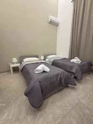 Letto o letti in una camera di Sicily charm B&B