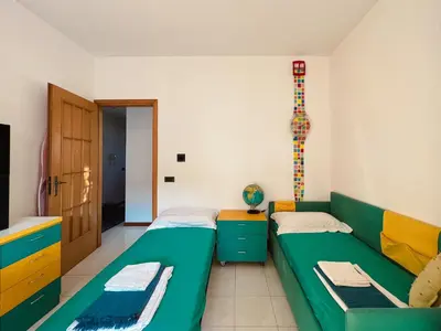 Letto o letti in una camera di Villa Cannizzaro
