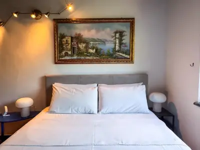 Letto o letti in una camera di Villa Etna
