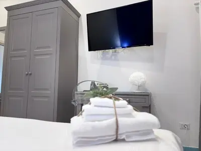 Letto o letti in una camera di Ognissanti Rooms