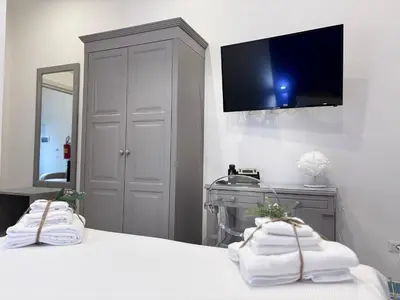 Letto o letti in una camera di Ognissanti Rooms