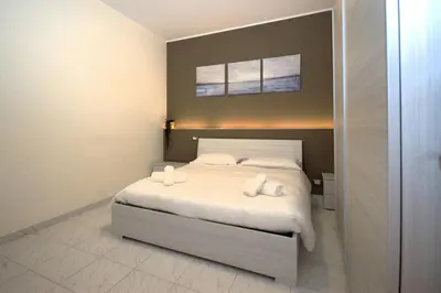 Letto o letti in una camera di Una Vita Vista Mare