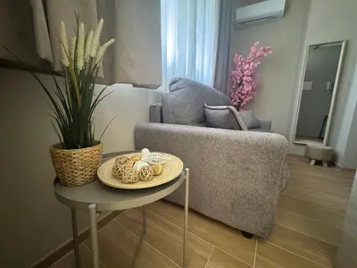 Area soggiorno di Palme Suites