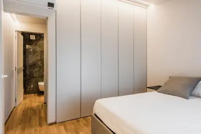 Letto o letti in una camera di Ferrini Home - Ramondetta 16