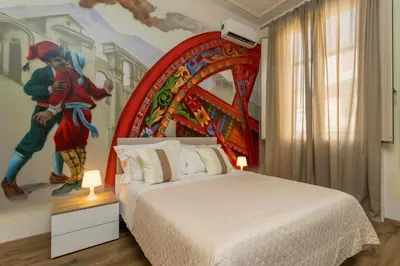 Letto o letti in una camera di Catania Urban Rooms - Artistic Design Rooms in Catania Center near Via Etnea