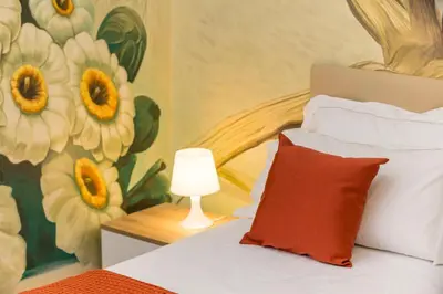 Letto o letti in una camera di Catania Urban Rooms - Artistic Design Rooms in Catania Center near Via Etnea